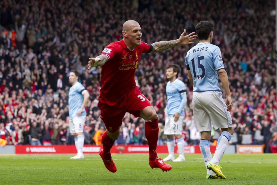 Liverpool's Martin Skrtel celebrates after scoring against Manchester City during their English Premier League soccer match at Anfield Stadium, Liverpool, England, Sunday April 13, 2014. (AP Photo/Jon Super)