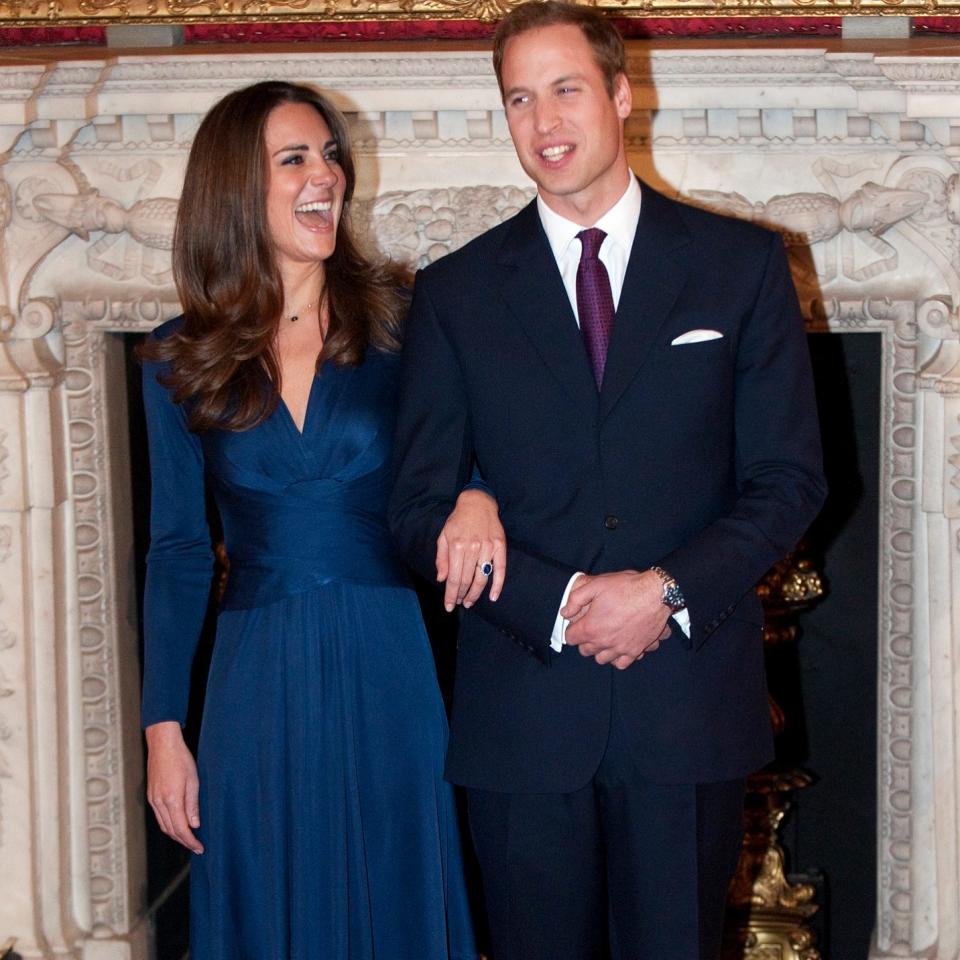 Kate Middleton wearing the sapphire blue Issa dress on the day her engagement to Prince William was announced -  Eddie Mulholland