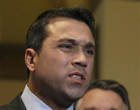 U.S. Representative Michael Grimm (R-NY) talks to the media after a meeting at the U. S. Capitol in Washington, in this January 2, 2013 file photo. REUTERS/Gary Cameron/Files