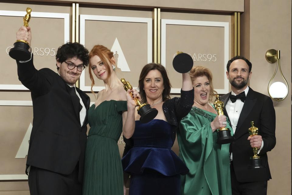 Daniel Roher, from left, Odessa Rae, Diane Becker, Melanie Miller and Shane Boris, winners of the award for best documentary feature film for "Navalny", pose in the press room at the Oscars on Sunday, March 12, 2023, at the Dolby Theatre in Los Angeles. (Photo by Jordan Strauss/Invision/AP)
