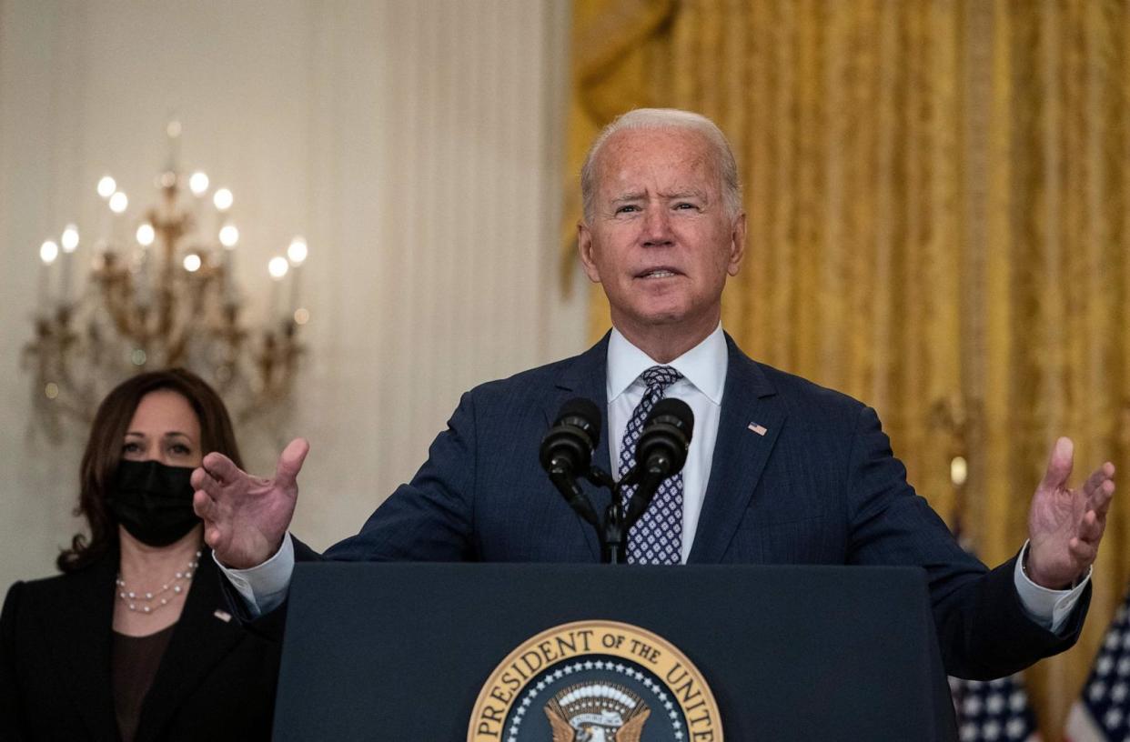 PHOTO: President Joe Biden, with Vice President Kamala Harris, responds to questions about the ongoing US military evacuations of US citizens and vulnerable Afghans, in Washington, DC, Aug. 20, 2021.  (Andrew Caballero-Reynolds/AFP via Getty Images)