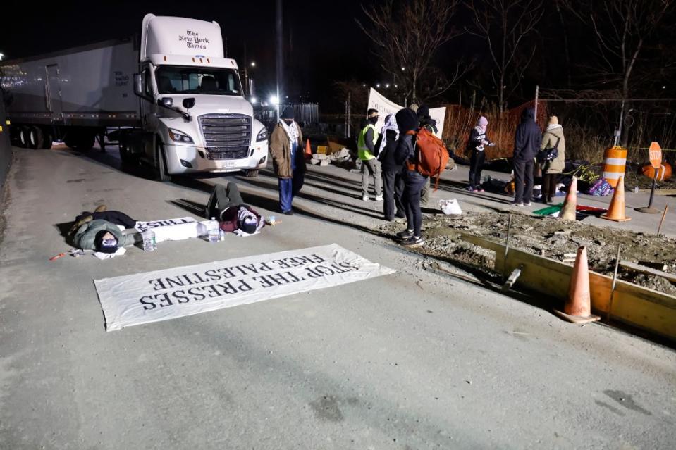 Anti-Israel protesters blocked the entrance to trucks so they could not load newspapers for delivery at the New York Times printing plant. Kevin C. Downs for NY Post