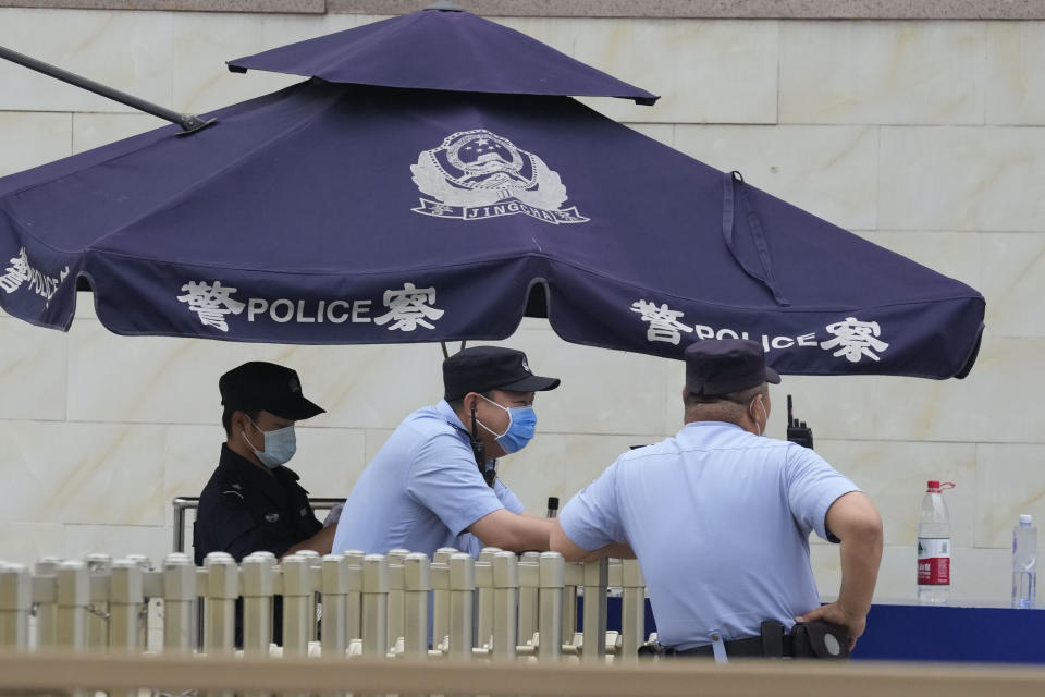 Police operate a checkpoint leading towards the Tiananmen Square area in Beijing on Wednesday, June 2, 2021. Communist Party leaders have imprisoned or driven activists into exile and largely succeeded in ensuring young people know little about the June 4, 1989, deadly crackdown on the pro-democracy movement. But after three changes of leadership since then, they are relentless in trying to prevent any mention of the military attack that killed hundreds and possibly thousands of people. (AP Photo/Ng Han Guan)