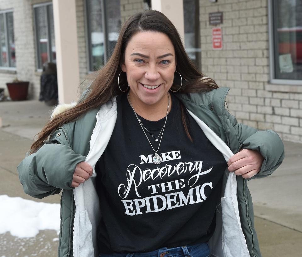 Tara Bijarro has recovered from her addictions and is proud to wear a shirt saying "Make Recovery The Epidemic."