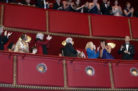 U.S. President Barack Obama (R) with first lady Michelle Obama greets the Kennedy Center Honorees at the Kennedy Center in Washington December 6, 2015. REUTERS/Yuri Gripas