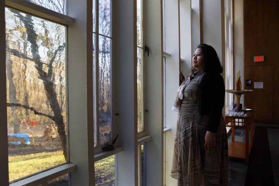 Rosa Gutierrez Lopez, from el Salvador, who a year ago became the first unauthorized immigrant to get refuge inside a religious institution in the Washington area, poses for a portrait at Cedar Lane Unitarian Universalist Church where she has been living in sanctuary for a year due to a deportation order, in Bethesda, Md., Thursday, Dec. 5, 2019. (AP Photo/Jacquelyn Martin)