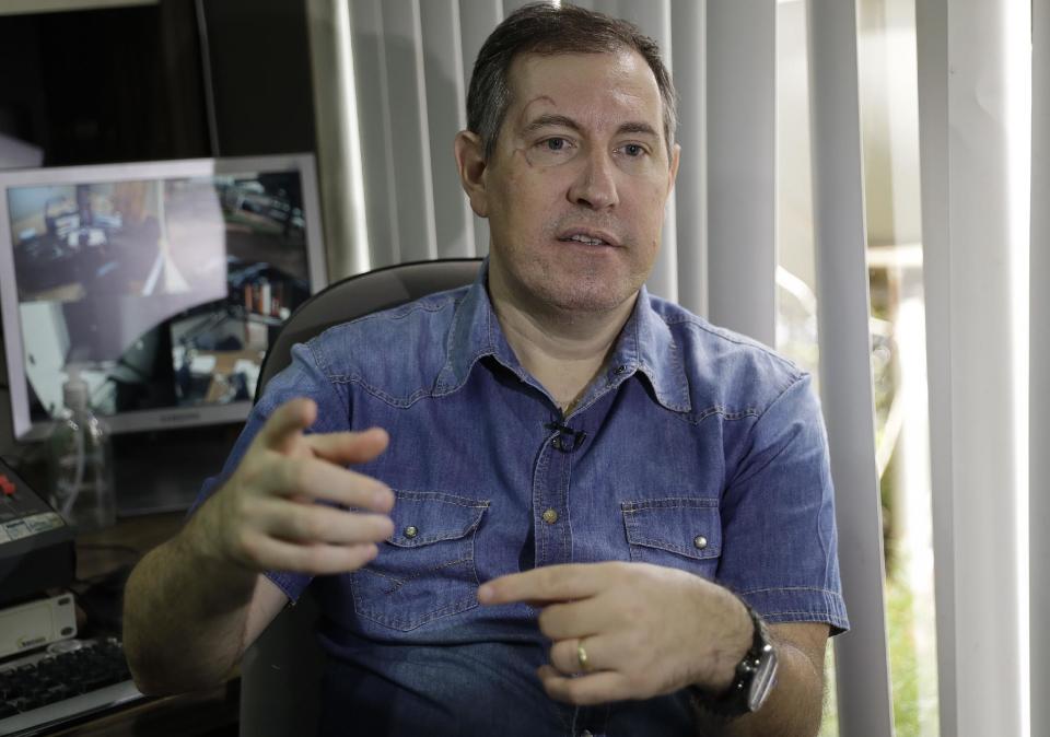 Radio soccer announcer Rafael Henzel speaks during a interview in Chapeco, Brazil, Wednesday, Jan. 18, 2017. Henzel is one of the six passengers that survived in the Chapecoense air crash, which killed 71 people, including 19 players of the Chapecoense soccer team, on Nov.28. (AP Photo/Andre Penner)