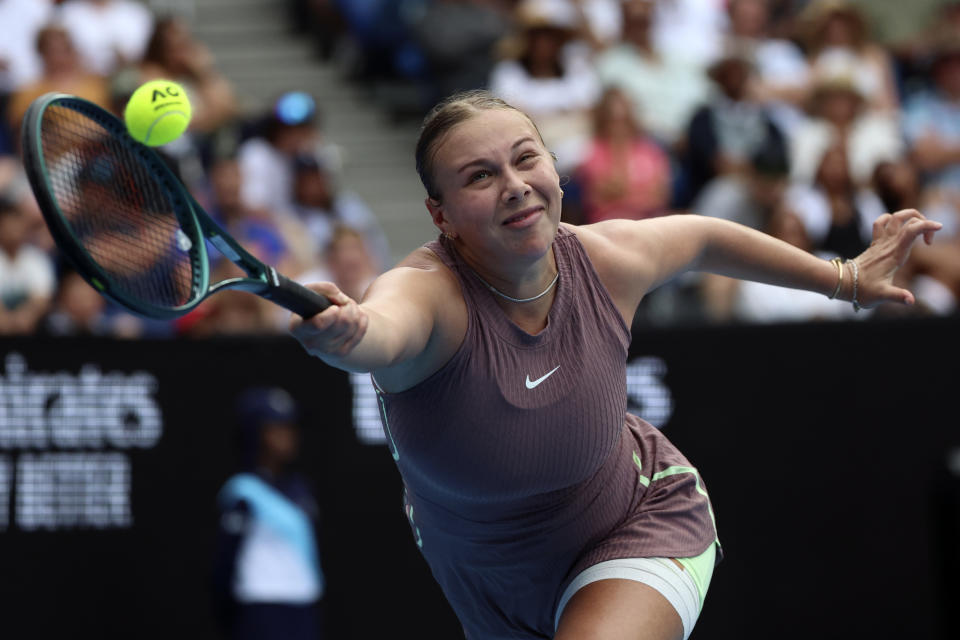 Amanda Anisimova of the U.S. plays a forehand return to Liudmila Samsonova of Russia during their first round match at the Australian Open tennis championships at Melbourne Park, Melbourne, Australia, Sunday, Jan. 14, 2024. (AP Photo/Asanka Brendon Ratnayake)