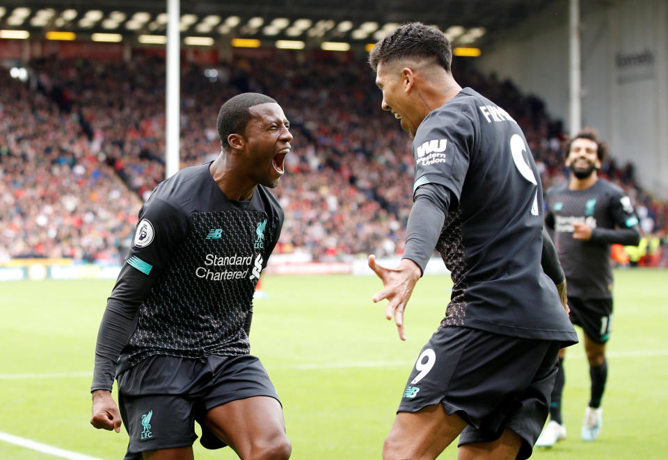 Soccer Football - Premier League - Sheffield United v Liverpool - Bramall Lane, Sheffield, Britain - September 28, 2019  Liverpool's Georginio Wijnaldum celebrates scoring their first goal with Roberto Firmino   REUTERS/Phil Noble  EDITORIAL USE ONLY. No use with unauthorized audio, video, data, fixture lists, club/league logos or "live" services. Online in-match use limited to 75 images, no video emulation. No use in betting, games or single club/league/player publications.  Please contact your account representative for further details.