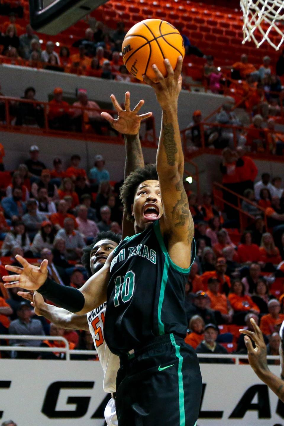 North Texas guard Kai Huntsberry (10) jumps to shoot in the second half during a college basketball game in the quarterfinals of the National Invitational Tournament between the Oklahoma State Cowboys (OSU) and the North Texas Mean Green at Gallagher-Iba Arena in Stillwater, Okla., Tuesday, March 21, 2023.