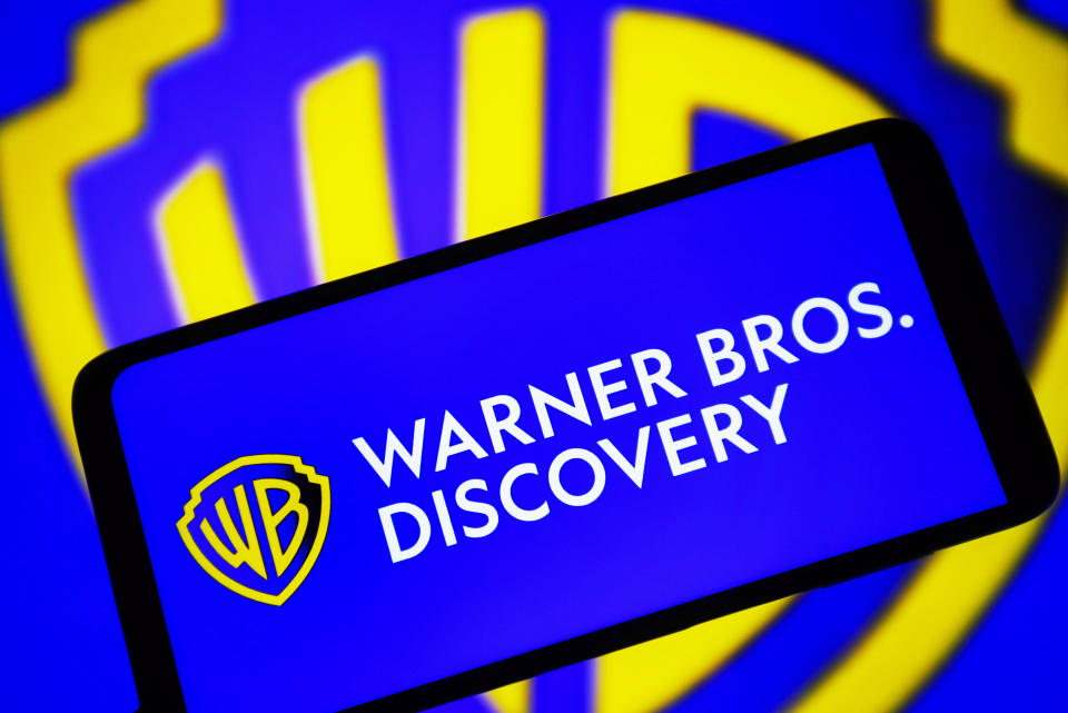 Warner Bros. Discovery reported a wider-than-expected loss in the third quarter as the media giant works to pare down its debt amid various challenges, including the Hollywood strikes and an unfavorable ad environment. (Photo Illustration by Pavlo Gonchar/SOPA Images/LightRocket via Getty Images)