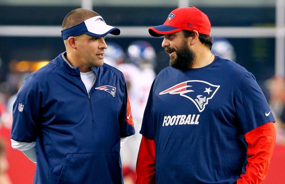 New England Patriots offensive coordinator Josh McDaniels, left, talks with defensive coordinator Matt Patricia before a 2015 game against the New York Giants in Foxboro.