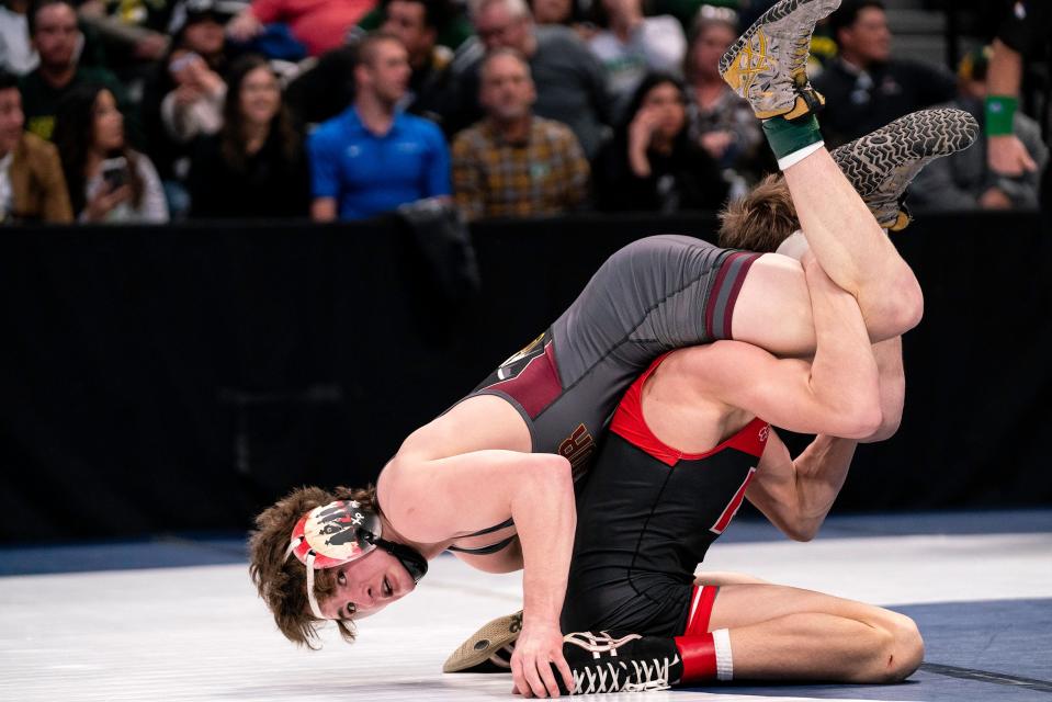 Windsor's John Kenney looks at the offical as time runs out of his match against Roosevelt's Chris LaLonde in the 126-pound class 4A finals during the Colorado state wrestling tournament at Ball Arena on Saturday, Feb. 18, 2023 in Denver, Colo.