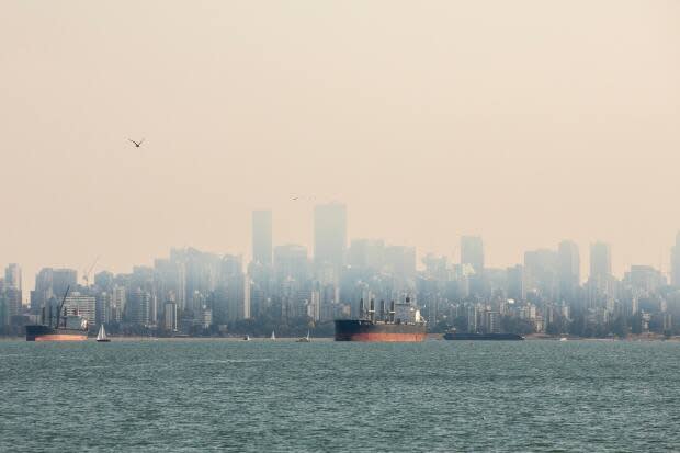 Smoke over downtown Vancouver last year. Scientists are warning residents to prepare for similar conditions as nearly 300 wildfires burn in B.C. (Ben Nelms/CBC - image credit)