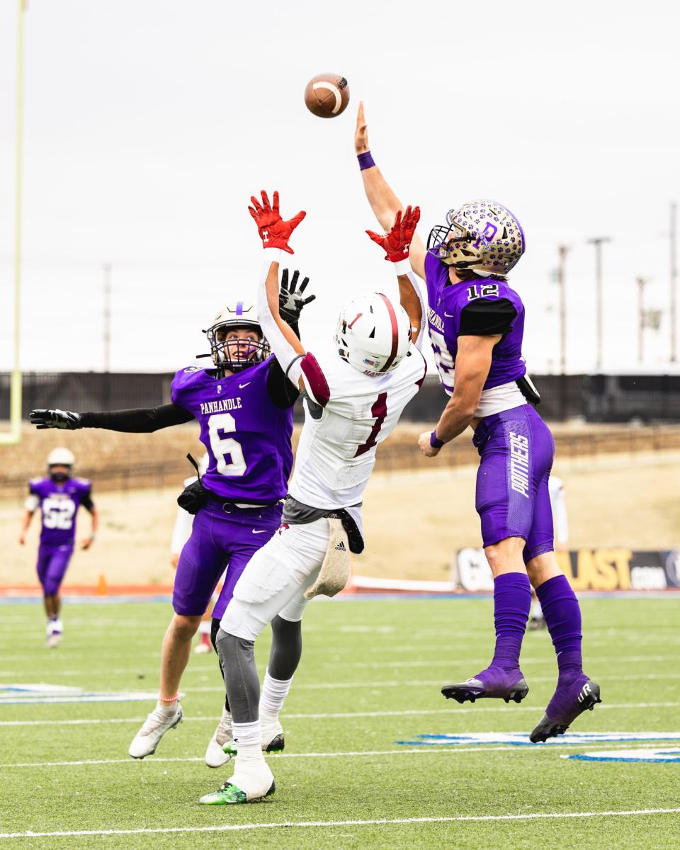 Panhandle’s Landon Durst (6) and Landyn Hack (12) defend against Hawley’s Chandlin Myers (1) in a playoff football game, Friday, Nov. 18, 2022, at PlainsCapital Park in Lubbock.