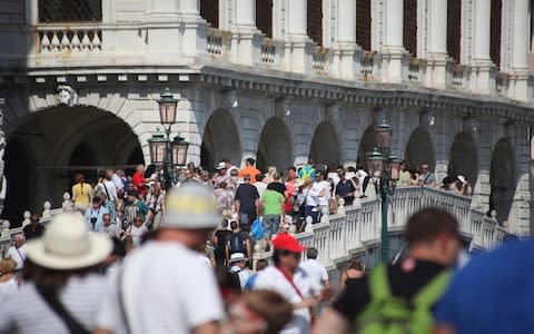 Venice is considering capping daily visitors to curb overtourism - Credit: Getty