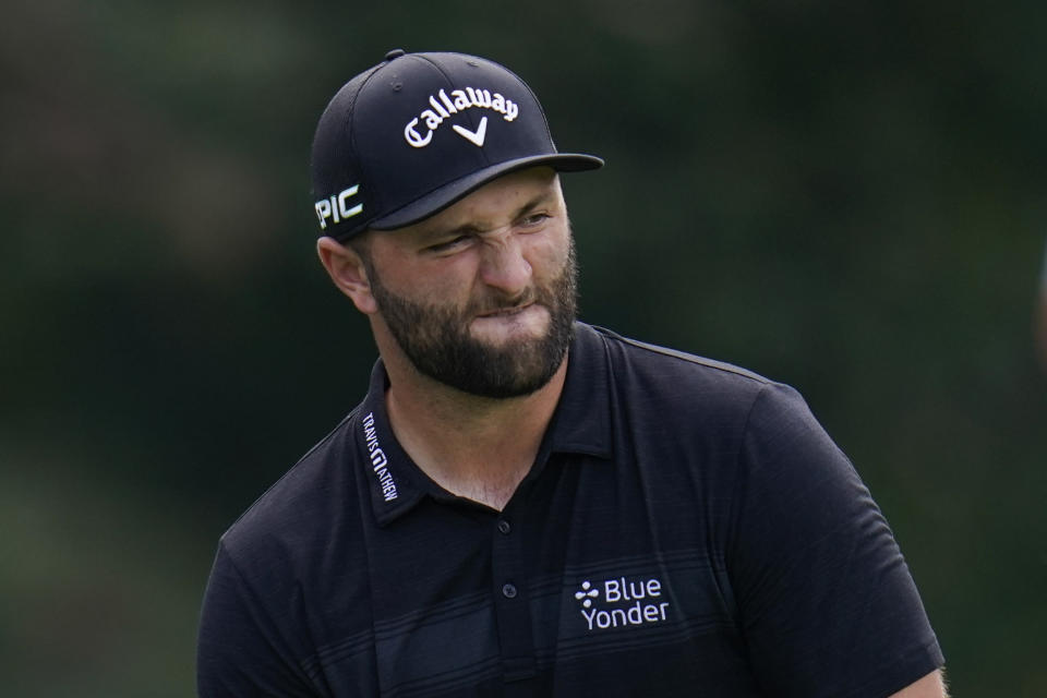 Jon Rahm, of Spain, reacts after putting on the tenth green during the second round of the BMW Championship golf tournament, Friday, Aug. 27, 2021, at Caves Valley Golf Club in Owings Mills, Md. (AP Photo/Julio Cortez)
