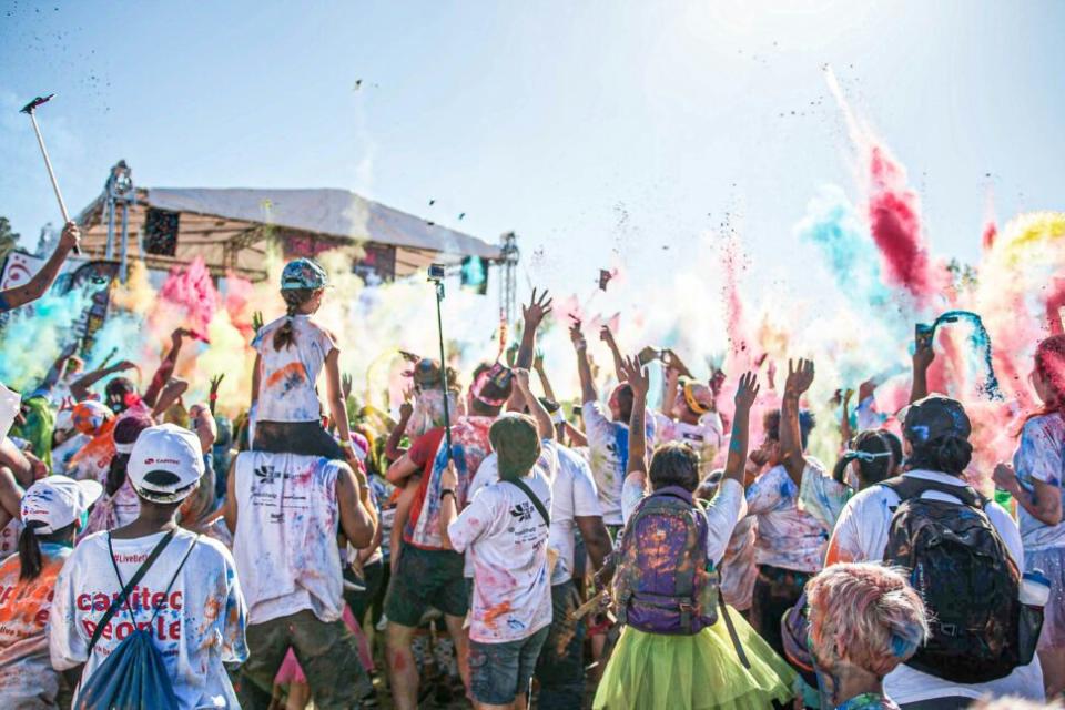 concert goers covered in paint