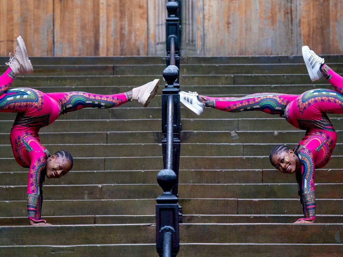 Performers from Afrique en Cirque during a photocall at the Mound in Edinburgh, ahead of their performances throughout the Edinburgh Festival Fringe (PA)