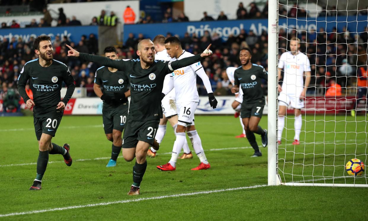 David Silva scored twice in Manchester City`s 4-0 win at Swansea, setting a Premier League record of 15 straight victories.