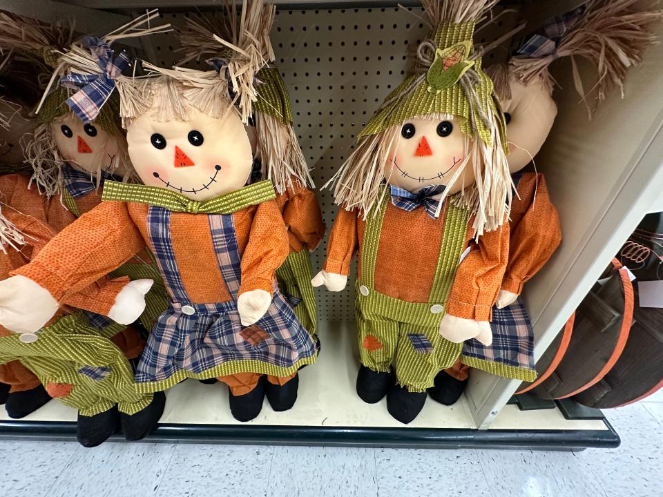 Two scarecrow figurines in a Hobby Lobby