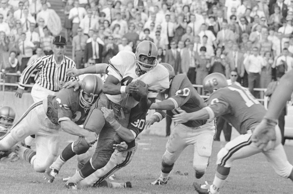 FILE - In this Sept. 12, 1966 file photo, Syracuse's Floyd Little (44) runs down the field despite during a college football game at Baylor Stadium in Waco, Texas. Little, the Hall of Fame running back who starred at Syracuse and for the Denver Broncos, has died. The Pro Football Hall of Fame said he died Friday, Jan. 1, 2021. (AP Photo/FK, File)