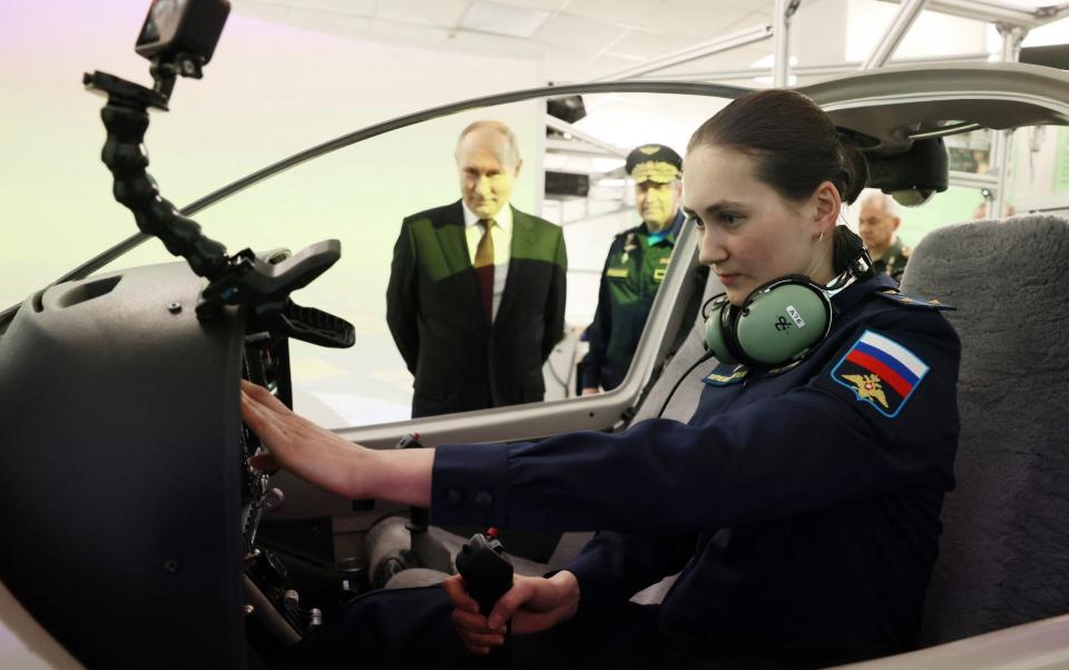 Putin admires a flight simulator