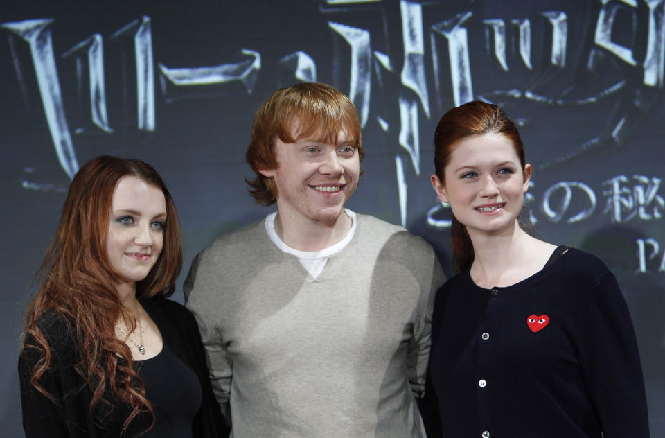 Cast members (L-R) Evanna Lynch, Rupert Grint and Bonnie Wright pose at a news conference for "Harry Potter and the Deathly Hallows: Part 1" in Japan November 18, 2010. REUTERS/Kim Kyung-Hoon (JAPAN - Tags: ENTERTAINMENT)