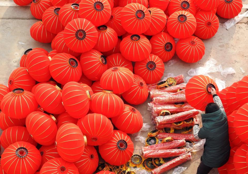 A worker makes red lanterns at a workshop ahead of Chinese Lunar New Year celebrations in Lianyungang, Jiangsu province, China January 10, 2020.