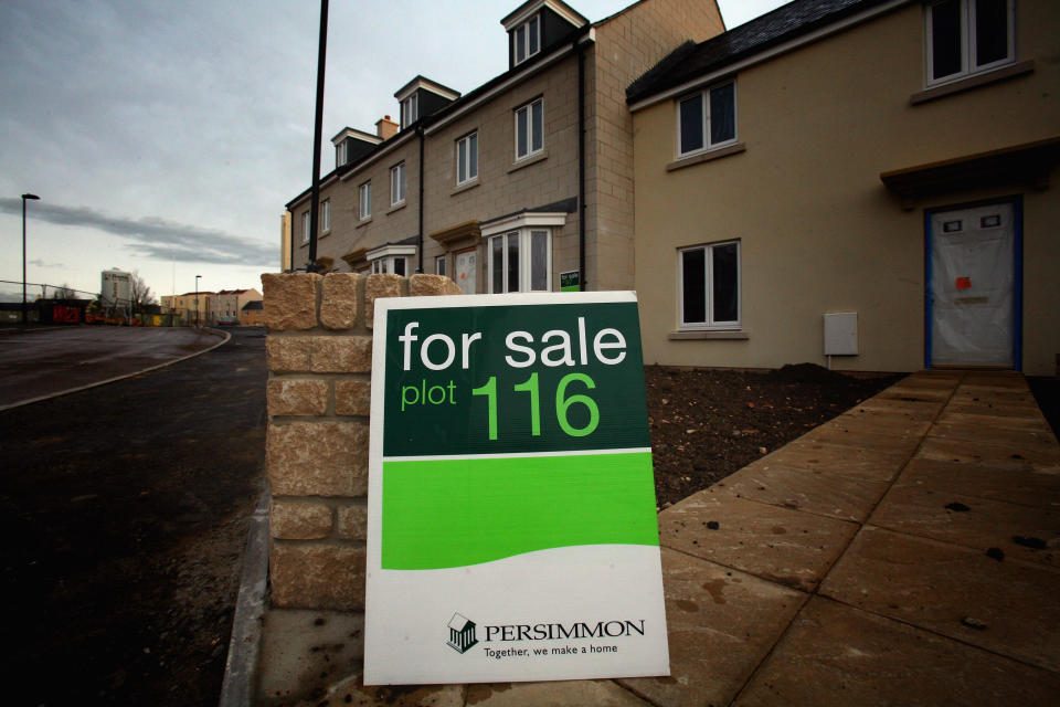 BATH, UNITED KINGDOM - APRIL 27:  A 'for sale' sign is displayed outside a new build house on a housing estate by developer and housebuilder Persimmon on April 27 2008 in Bath, England. Persimmon, the UK's largest housebuilder, has suddenly cancelled planned new developments after reporting a sudden decline in the housing market over the past few weeks claiming sales of new homes so far this year were down 24 percent as the credit crunch countinued to bite.  (Photo by Matt Cardy/Getty Images)