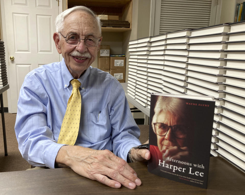 Alabama historian Wayne Flynt holds a copy of his new book, "Afternoons with Harper Lee," about the late author of "To Kill a Mockingbird," at a book-signing in Homewood, Ala., on Thursday, Sept. 22, 2022. Flynt and his late wife were friends with Lee, who died in 2016. (AP Photo/Jay Reeves)