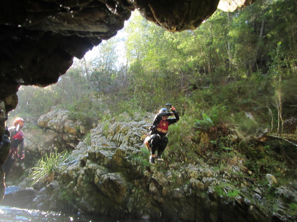 Canyoning, known as kloofing in South Africa, involves abseiling, jumping and zip-lining through river rapids. Source: Yahoo Lifestyle