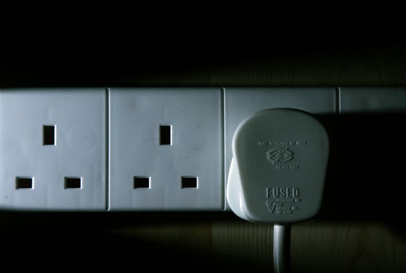 An electricity cable is plugged into the mains at a home in southern England