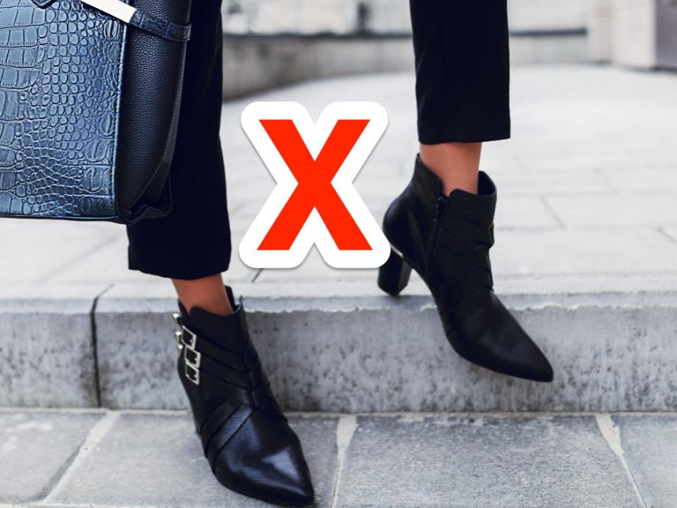 red x next to person wearing black pants and black ankle boots carrying a big black bag