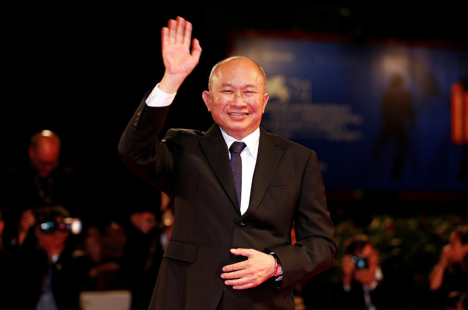 REFILE - CORRECTING TYPO IN FILM NAME:  Director John Woo waves as he arrives during a red carpet event for the movie 