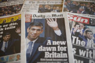 FILE - A selection of the front pages of British national newspapers showing the reaction after Rishi Sunak won the Conservative Party leadership contest in London, Oct. 25, 2022. In his first month as Britain's prime minister, Rishi Sunak has stabilized the economy, reassured allies from Washington to Kyiv and even soothed the European Union after years of sparring between Britain and the bloc. But Sunak’s challenges are just beginning. He is facing a stagnating economy, a cost-of-living crisis – and a Conservative Party that is fractious and increasingly unpopular after 12 years in power. (AP Photo/David Cliff, File)