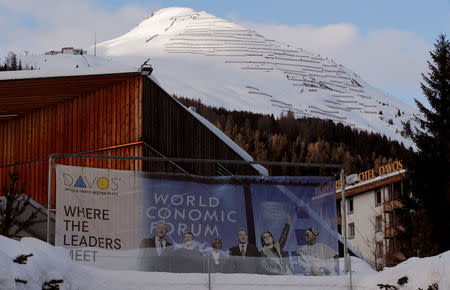 A banner of the World Economic Forum (WEF) is seen in front of the congress centre in the Swiss mountain resort of Davos, Switzerland, January 11, 2018 REUTERS/Arnd Wiegmann