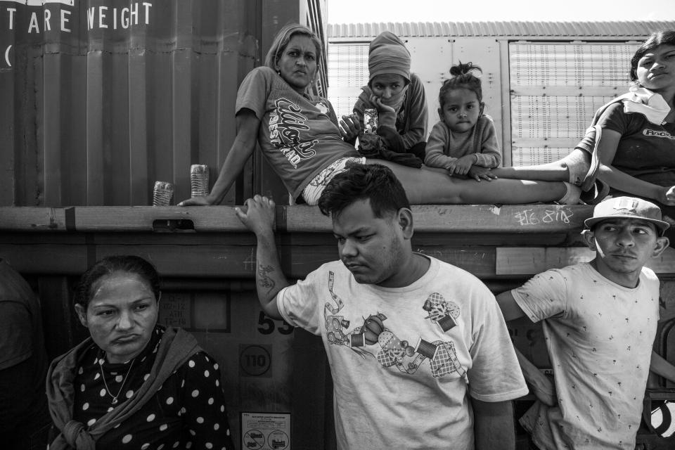 Migrants at a train rail yard in Chihuahua City wait to see if will be allowed to re-board a train bound for Ciudad Juárez. The migrants were eventually removed from the rail yard.