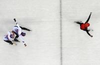 Short Track Speed Skating Events - Pyeongchang 2018 Winter Olympics - Men's 500m Finals - Gangneung Ice Arena - Gangneung, South Korea - February 22, 2018 - Gold medallist Wu Dajing of China skates to victory ahead of silver medallist Hwang Dae-heon of South Korea and bronze medallist Lim Hyo-jun of South Korea. REUTERS/Lucy Nicholson