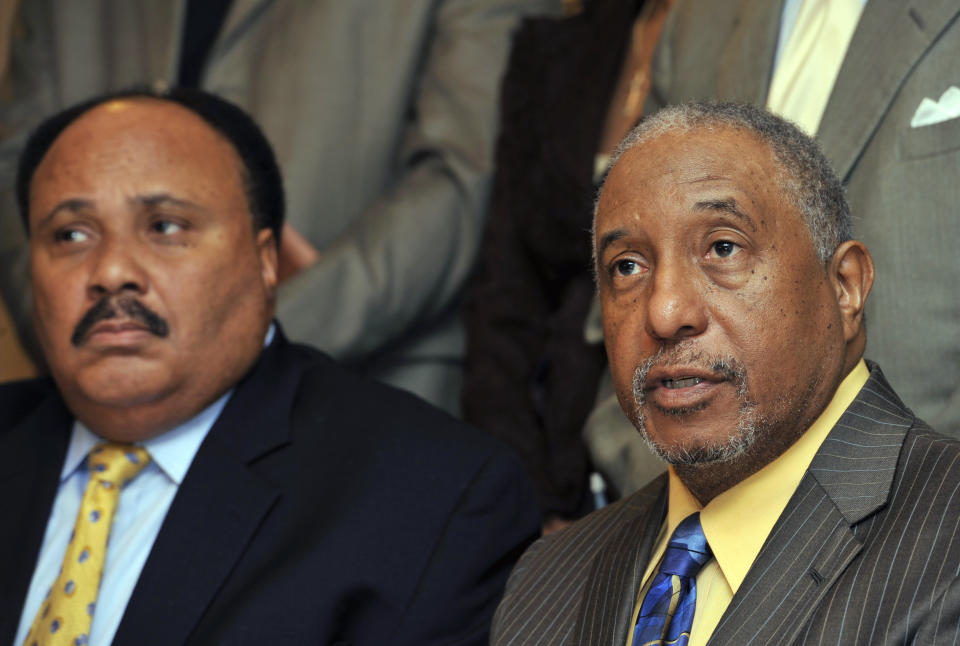 FILE - In this March 6, 2010, file photo, Southern Christian Leadership Conference spokesman Bernard LaFayette, right, speaks to reporters as Martin Luther King III, left, looks on in Atlanta. LaFayette attended nonviolence workshops led by Rev. James Lawson during the civil rights struggles of the 1960s. (AP Photo/Gregory Smith)