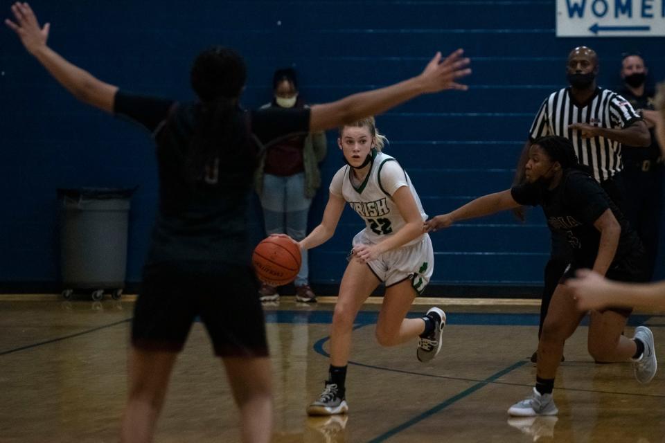 Notre Dame's Mya Wardle drives the ball downcourt during a game at Notre Dame High School on Tuesday, Dec. 14, 2021. The Lady Irish beat the Lions 44-43 in double overtime.