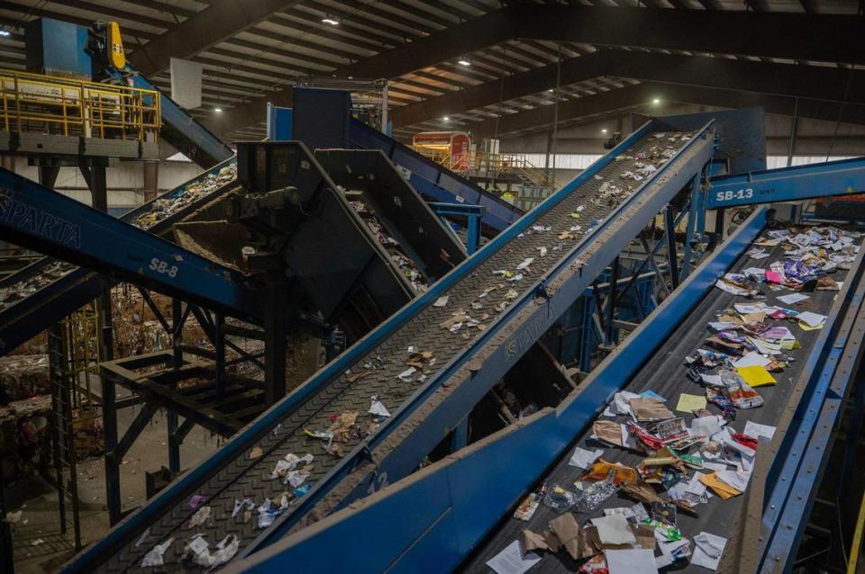 A variety of recycled material is separated and transported through conveyor belts at the GFL Materials Recovery Facility on Tuesday, March 28, 2023, in Harrisonville, Mo.