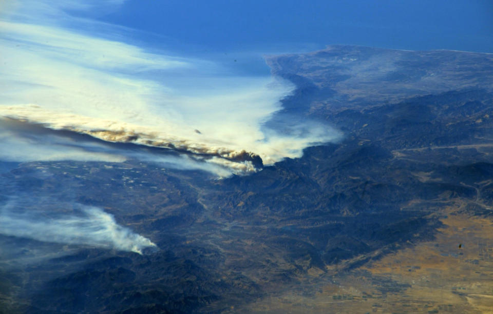 <p>A photo taken from the International Space Station and moved on social media by astronaut Randy Bresnik shows smoke rising from wildfire burning in Southern California, Dec. 6, 2017. (Photo: @AstroKomrade/NASA/Handout via Reuters) </p>