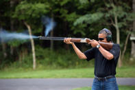 <p>President Barack Obama shoots clay targets with a shotgun on the range on August 4, 2012 at Camp David, Maryland. Obama has put forth great effort to pass legislation to ban assault rifles in the wake of the Newtown, CT shooting and was recently quoted as saying “we do skeet shooting all the time,” at Camp David. (Pete Souza/The White House via Getty Images) </p>