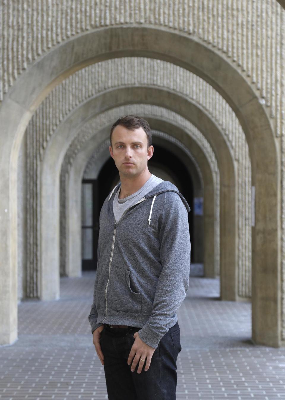 Army Capt. Matthew Ball poses for a portrait at the Stanford University law school Monday, Jan. 30, 2017, in Stanford, Calif. Ball said his interpreter Qismat Amin, who has been living in hiding after getting threats from Taliban and Islamic state fighters, got his visa Sunday, after nearly four years of interviews. Ball bought him a $1,000 plane ticket to San Francisco and plans to meet him at the airport with an attorney. (AP Photo/Marcio Jose Sanchez)