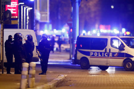 French special police forces secure an area during a police operation where the suspected gunman, Cherif Chekatt, who killed three people at a Christmas market in Strasbourg, was killed, in the Meinau district in Strasbourg, France, December 13, 2018. REUTERS/Christian Hartmann .