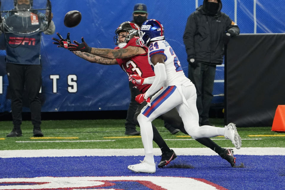 Tampa Bay Buccaneers' Mike Evans, left, catches a ball in the end zone for a touchdown in front of New York Giants' James Bradberry during the second half of an NFL football game, Monday, Nov. 2, 2020, in East Rutherford, N.J. (AP Photo/Corey Sipkin)