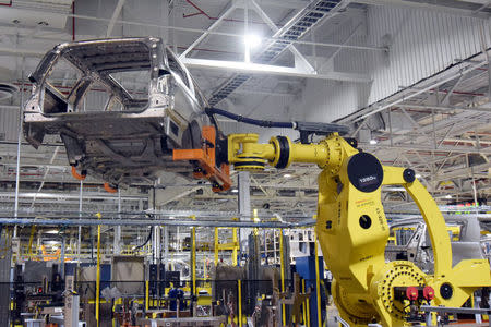 A large robot nicknamed ÒKongÓ lifts the body of a Ford Expedition SUV at Ford's Kentucky Truck Plant as the No. 2 U.S. automaker ramps up production of two large SUV models in Louisville, Kentucky, U.S., February 9, 2018. REUTERS/Nick Carey