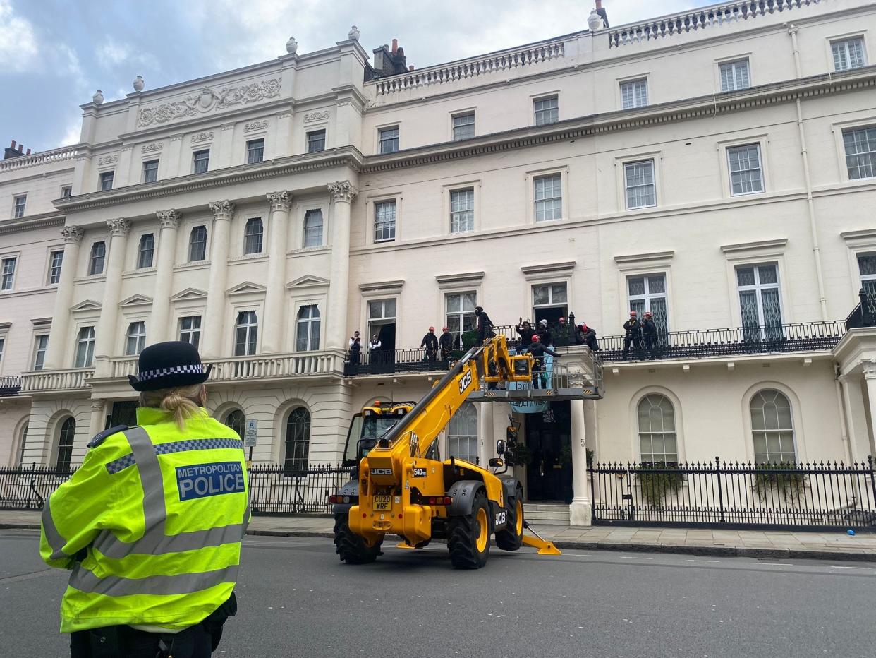 Activists and police outside Russian oligarch Oleg Deripaska house