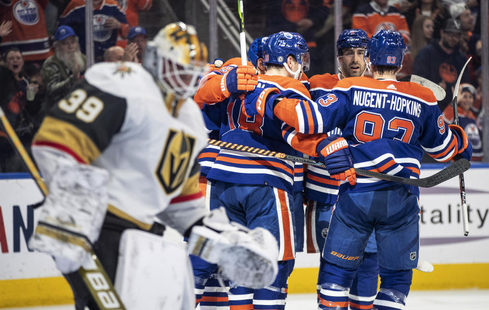 Vegas Golden Knights goalie Laurent Brossoit (39) looks away as the Edmonton Oilers celebrate a goal during the second period of an NHL hockey game Saturday, March 25, 2023, in Edmonton, Alberta. (Jason Franson/The Canadian Press via AP)